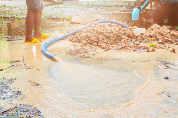 broken pipe in hole with water motion at roadside and plumber working repair broken pipe in hole with water motion at roadside and plumber working repair